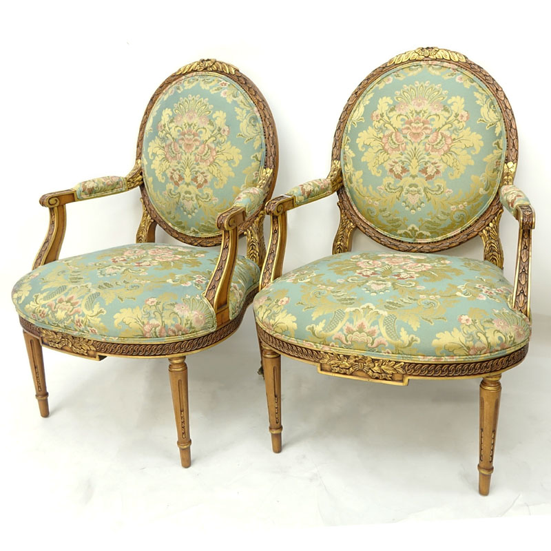 Pair of Karges Carved Parcel Gilt Wood Upholstered Louis XIV Style Fauteuils.