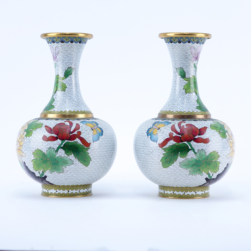 Pair Vintage Chinese Brass and Cloisonne Vases. Flower and butterfly motif. One with label. Light wear. Measures 10-1/4" H. Shipping $62.00 (estimate $100-$150)