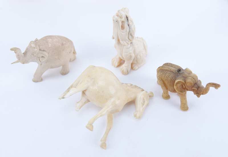 Collection of Nine (9) Carved Ivory Animals. Includes elephants, bird, horse, foo lion. 