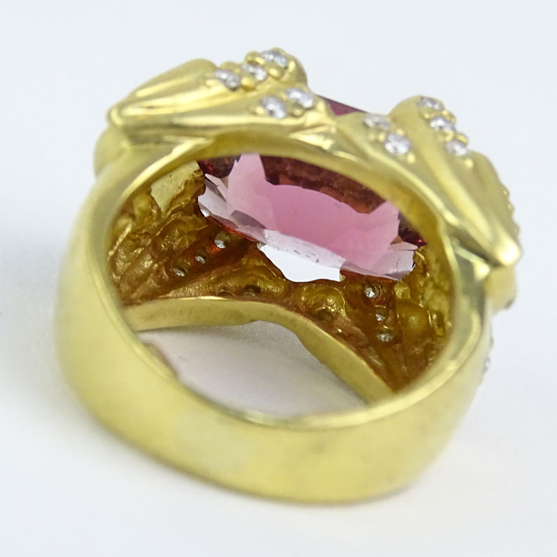 Oval Cut Salmon Pink Tourmaline, Diamond and 14 Karat Yellow Gold Ring. 