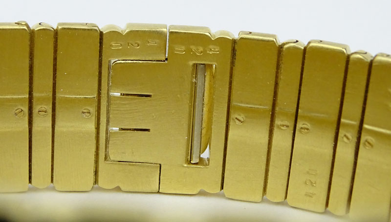 Men's Vintage Piaget Polo 18 Karat Yellow Gold Bracelet Watch with Quartz Movement 381513 with Box.