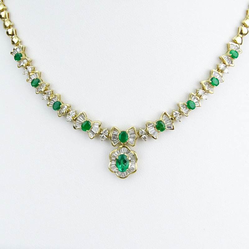 Vintage Approx. 2.20 Carat Baguette and Round Brilliant Cut Diamond, Oval Cut Emerald and 14 Karat Yellow Gold Pendant Necklace.