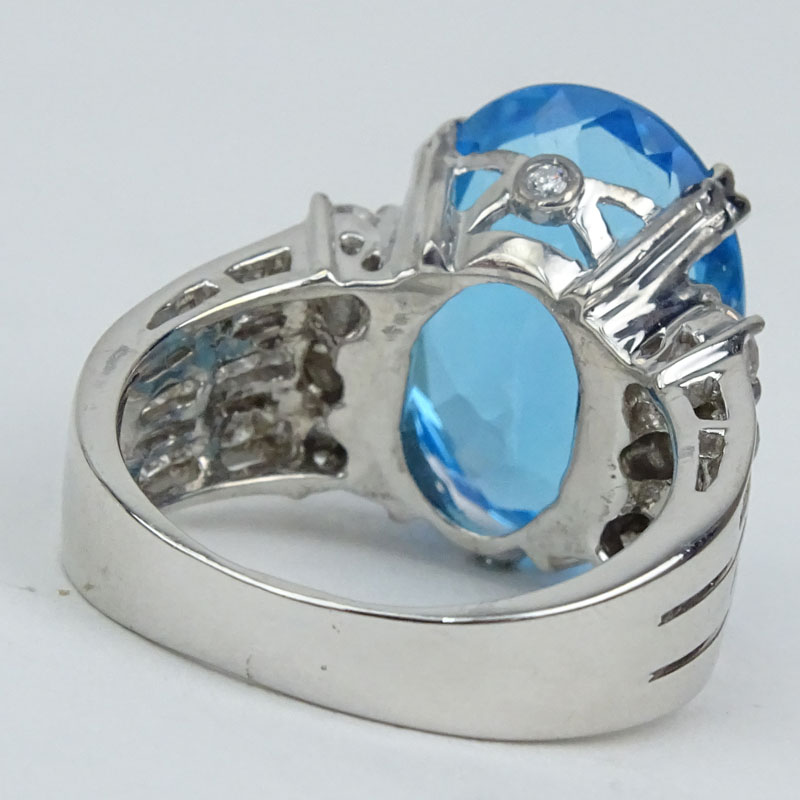 Approx. 15.0 Carat Oval Cut London Blue Topaz, 1.20 Carat Round Brilliant Cut Diamond and 18 Karat White Gold Ring.