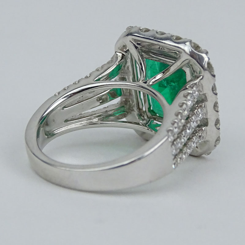 GIA Certified 7.20 Carat Colombian Emerald, 2.58 Carat Round Brilliant Cut Diamond and 18 Karat White Gold Ring.