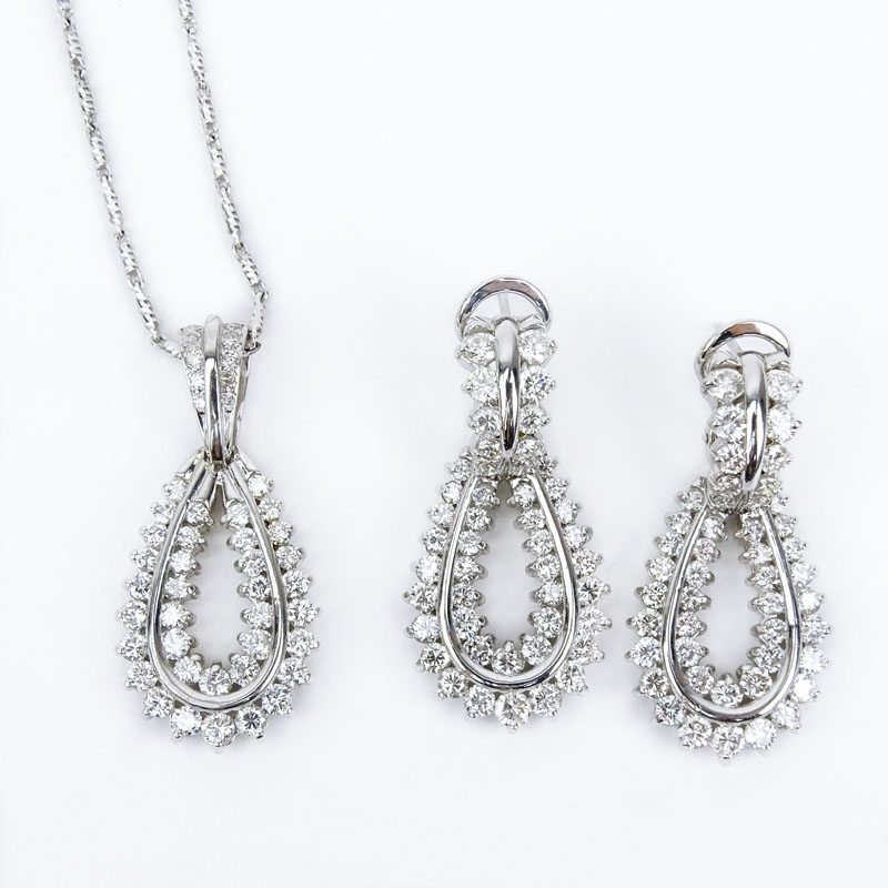 Vintage Approx. 7.0 Carat TW Round Brilliant Cut Diamond and 18 Karat White Gold Pendant Necklace and Earring Suite.