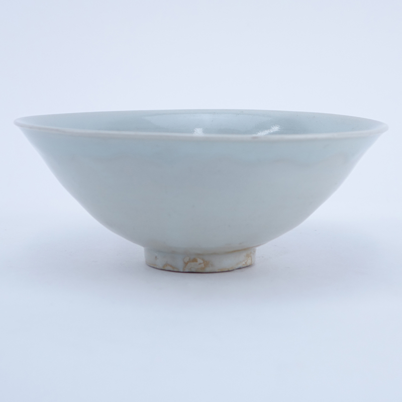 Chinese Song Dynasty (1127–1279) Oingbai Ware Bowl. a bowl with freely combed wavy lines in the interior covered with pale bluish-green glaze.
