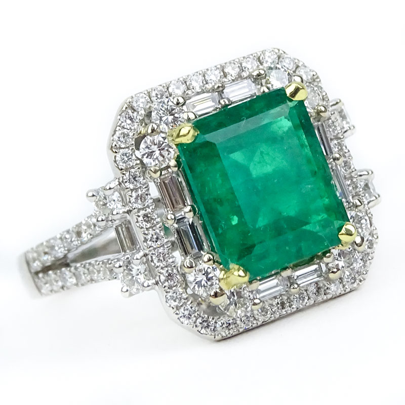 Approx. 2.50 Carat Colombian Emerald, 1.40 Carat Round Brilliant and Baguette Cut Diamond and 18 Karat White Gold Ring. 