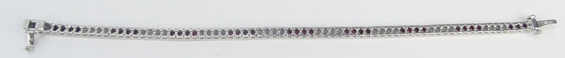  3.82 Carat Calibre Cut Ruby, 1.76 Carat Round Brilliant Cut Diamond and Platinum Bracelet.
