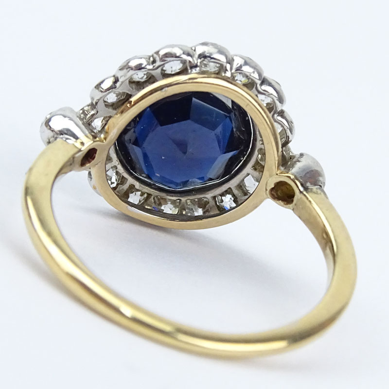  3.0 Carat Round Cut Sapphire, 1.0 Carat Round Cut Diamond, Platinum and 18 Karat Yellow Gold Ring. 