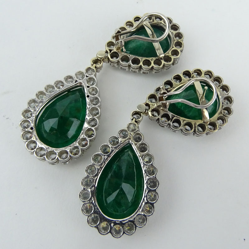  70.0 Carat Pear Shape Colombian Emerald, 11.0 Carat Round Brilliant Cut Diamond  and Platinum Pendant Earrings.