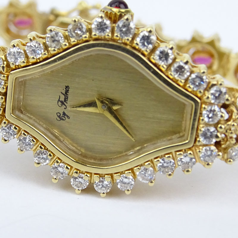 5.50 Carat Round Brilliant Cut Diamond, 4.50 Carat Oval Cut Ruby and 14 Karat Yellow Gold Bracelet Watch with Quartz Movement.