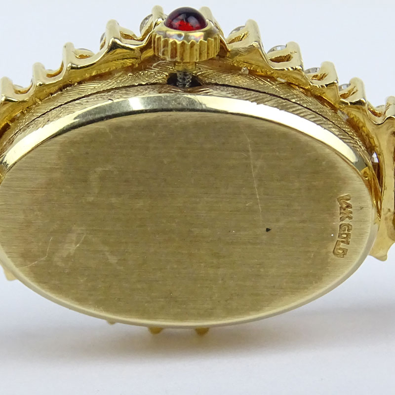 5.50 Carat Round Brilliant Cut Diamond, 4.50 Carat Oval Cut Ruby and 14 Karat Yellow Gold Bracelet Watch with Quartz Movement.