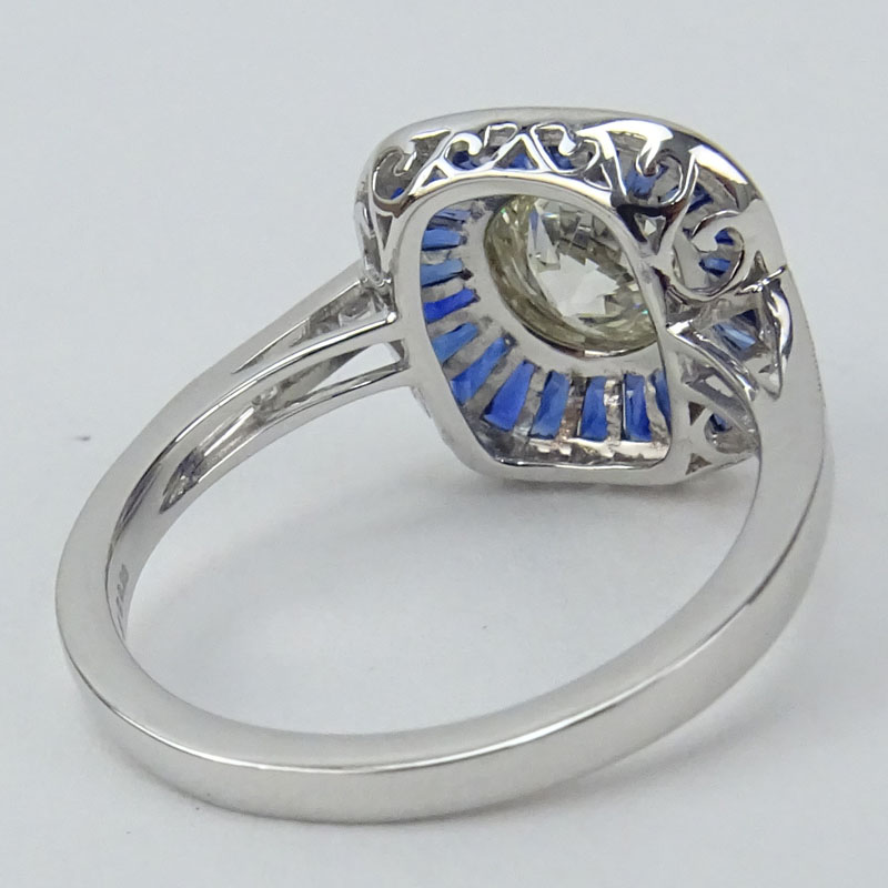 .95 Carat Old European Cut Diamond, .87 Carat Calibre Cut Sapphire and Platinum Ring.