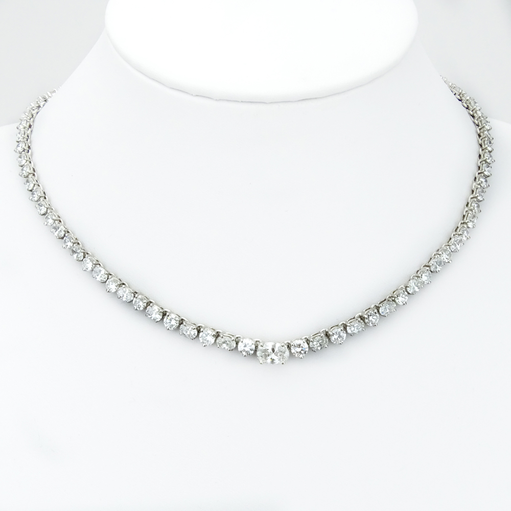 25.0 Carat Eighty-Five (85) Alternating Round Brilliant and Oval Cut Diamond and 14 Karat White Gold Riviera Necklace.