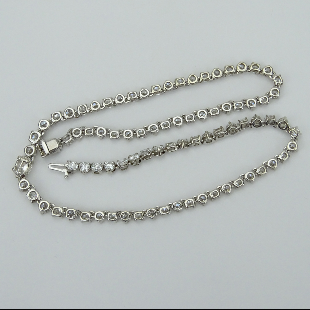 25.0 Carat Eighty-Five (85) Alternating Round Brilliant and Oval Cut Diamond and 14 Karat White Gold Riviera Necklace.