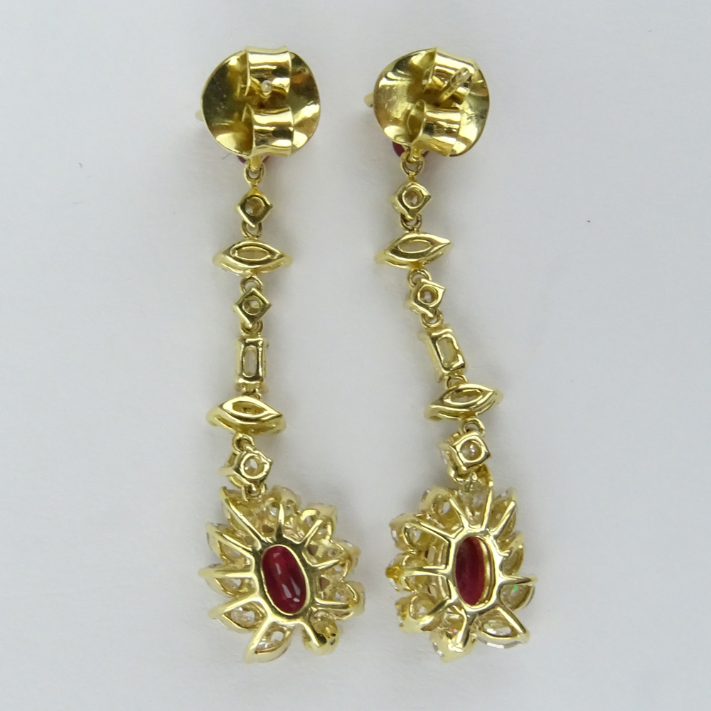 5.90 Carat Multi Cut Diamond, Oval and Round Cut Burma Ruby and 18 Karat Yellow Gold Drop Earrings. 