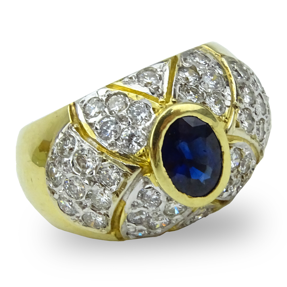  1.0 Carat Oval Cut Sapphire, 1.52 Carat Pave Set Diamond and 14 Karat Yellow Gold Ring. 