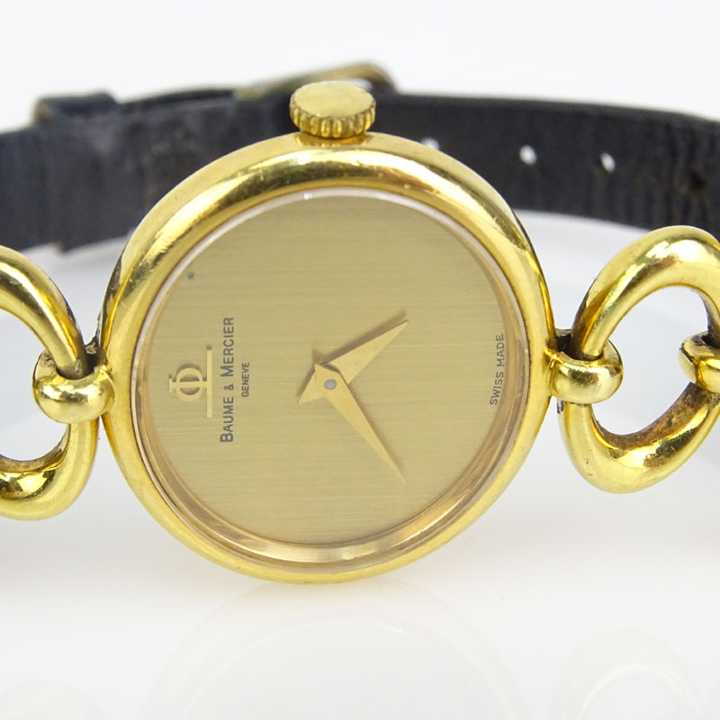 Lady's Vintage Baume & Mercier Geneve 18 Karat Yellow Gold Watch with Swiss Manual Movement and with Leather Strap and original Gold Plate Strap Buckle