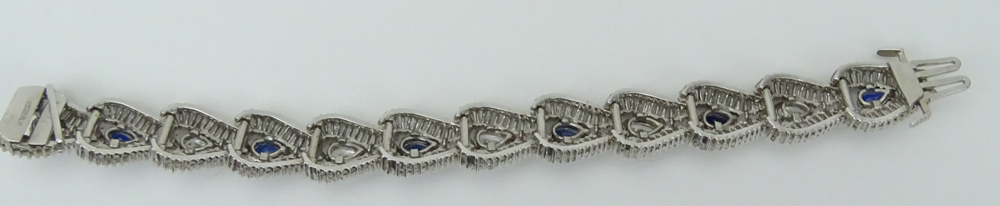 1950s Approx. 21.0 Carat Pear Shape and Baguette Cut Diamond, 4.8 Carat Pear Shape Sapphire and Platinum Bracelet. 