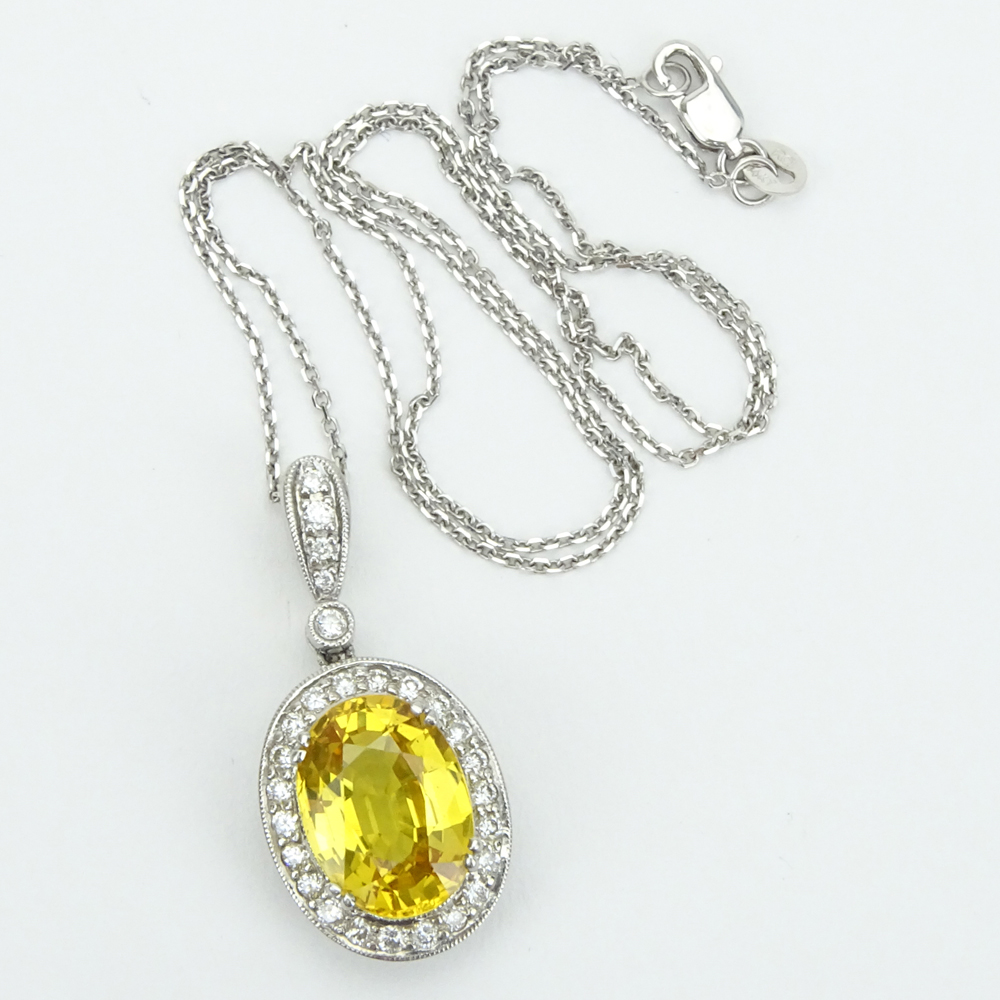 6.50 Carat Oval Cut Yellow Sapphire, .65 Carat Round Brilliant Cut Diamond and 18 Karat White Gold pendant Necklace. 