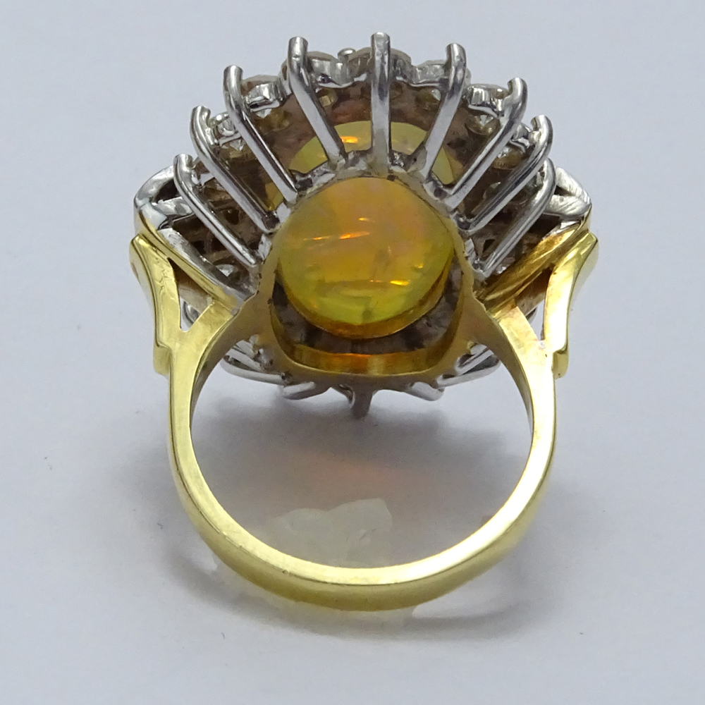 Circa 1970s Oval Cabochon Opal, Diamond, Platinum and 18 Karat Yellow Gold Ring