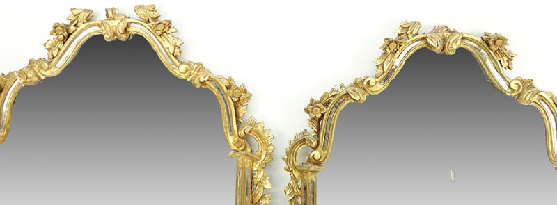 Pair of mid 20th Century Italian Carved and Giltwood Mirrors
