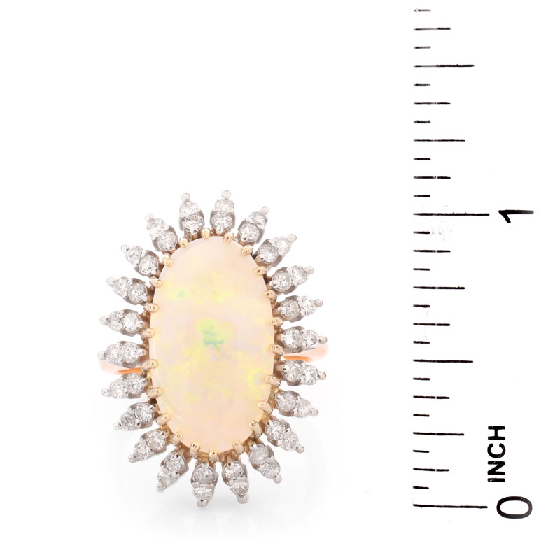 Vintage Approx. 4.60 Carat Oval Cabochon Opal, 1.0 Carat Round Brilliant Cut Diamond and 14 Karat Yellow Gold Ring