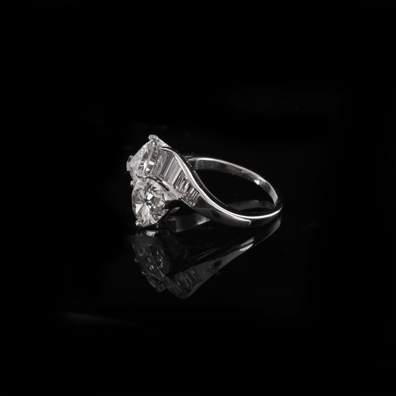 Vintage Approx. 1.47 Carat Pear Shape Diamond, 1.22 Carat Pear Shape Diamond and Platinum Cross Over Ring