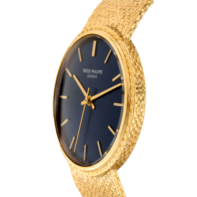 Man's Vintage Patek Philippe 18 Karat Yellow Gold Automatic Movement Bracelet Watch with Blue Dial.