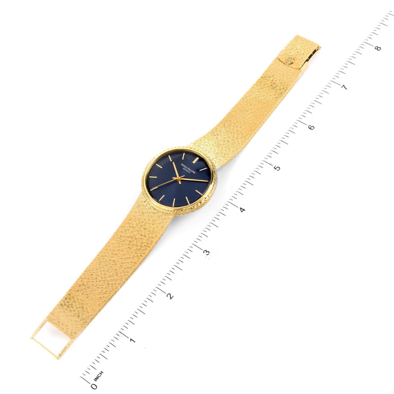 Man's Vintage Patek Philippe 18 Karat Yellow Gold Automatic Movement Bracelet Watch with Blue Dial.