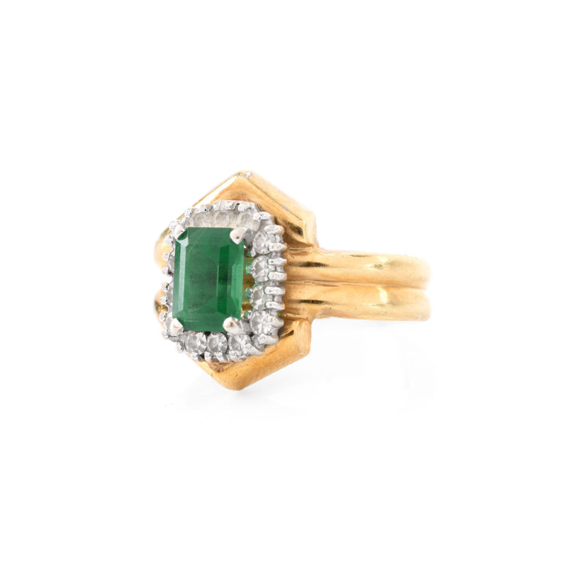 Vintage Emerald, Diamond and 14 Karat Yellow Gold Ring. Emerald measures 7 x 5mm. Stamped 14K. Good vintage condition.