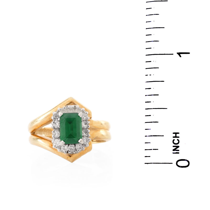 Vintage Emerald, Diamond and 14 Karat Yellow Gold Ring. Emerald measures 7 x 5mm. Stamped 14K. Good vintage condition.