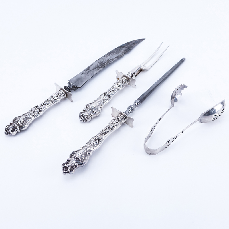 Four (4) Sterling Silver Serving Utensils. Includes Wallace Irian sterling handled carving set with sharpening steel and Watson reticulated serving tongs.