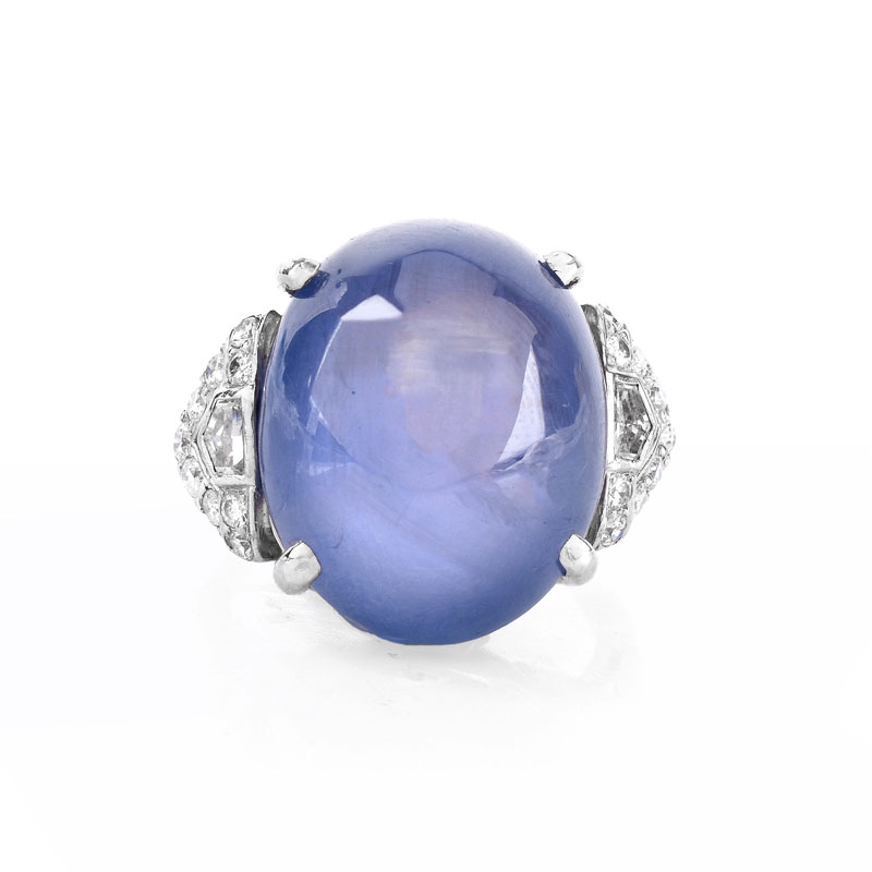 Art Deco Approx. 35.0 Carat Oval Cabochon Star Sapphire, .80 Carat Diamond and Platinum Ring.