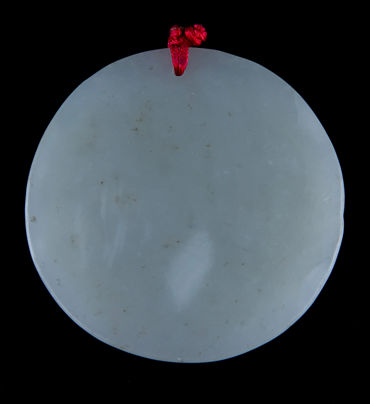 A Chinese Carved Light Celadon Jade Circular Pendant. Birds in nature with archaic patterns.