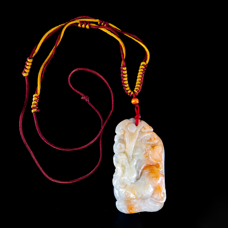 Antique Chinese Carved Celadon to Russet Jade Pendant on Cord Necklace. High relief foo dog.