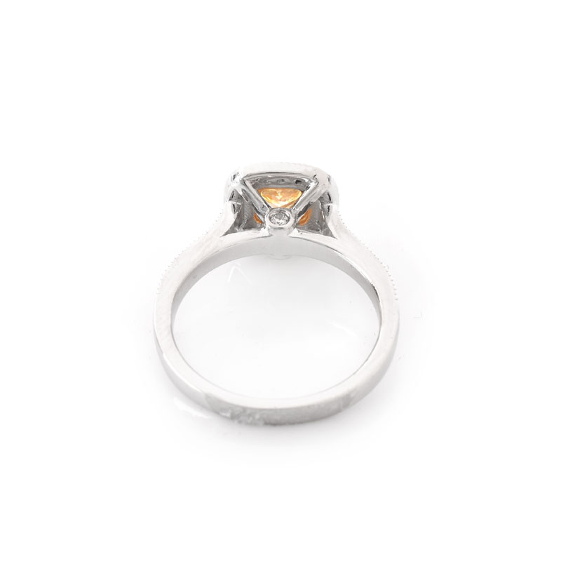 GIA Certified .59 Carat Fancy Yellow Diamond, .65 Carat Round Brilliant Cut Diamond and 18 Karat White and Yellow Gold Engagement Ring. Yellow diamond SI2 clarity.