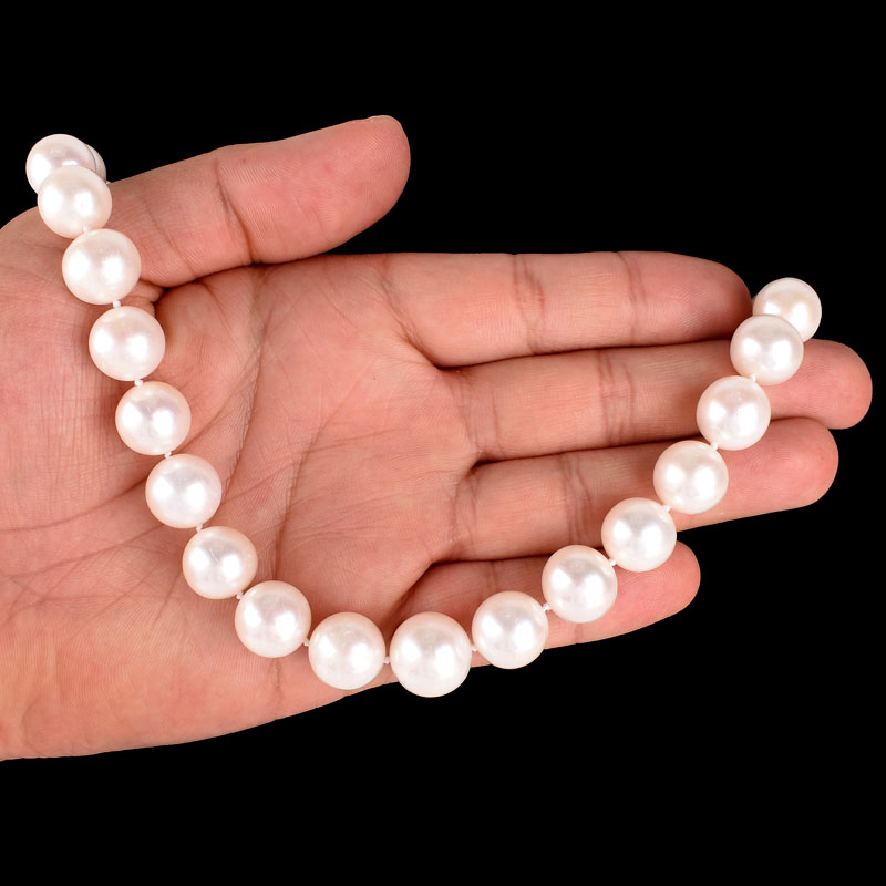 Single Strand Thirty Three (33) 13-15mm South Sea Pearl Necklace with 14 Karat Yellow Gold Clasp.