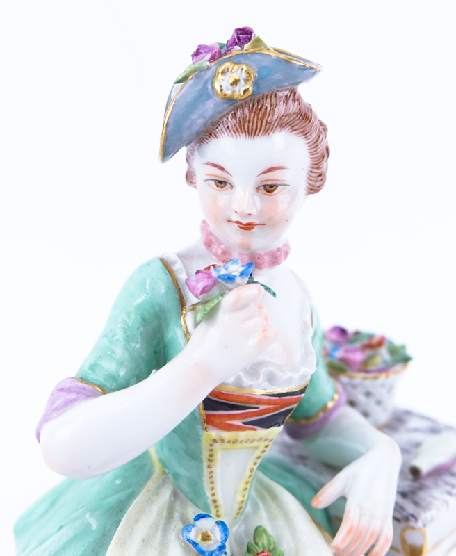 Antique Meissen Porcelain Figurine "Seated Young Lady". Signed with crossed sword mark.