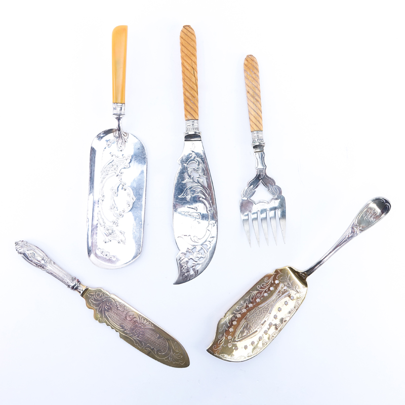 Collection of Five (5) Antique Silver Plate Serving Utensils. Includes: crumber, fish knife and fork set, fish knife (silver handle), fish server.
