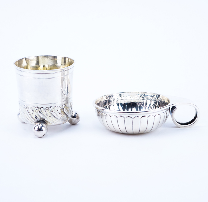Two (2) Silver Lot. Includes Bavarian early beaker with ball feet and a Mexican silver tastevin.