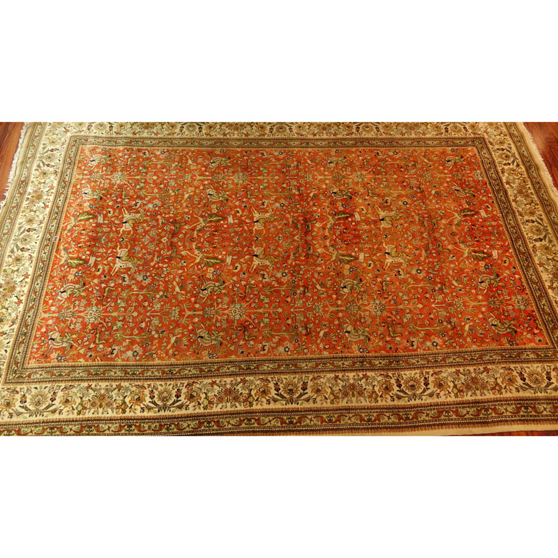 Large Semi Antique Karastan Persian Rug. Floral motif with hunting scenes. Discoloration, dirty, wear to fringes, loss to corner. 