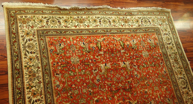 Large Semi Antique Karastan Persian Rug. Floral motif with hunting scenes. Discoloration, dirty, wear to fringes, loss to corner. 