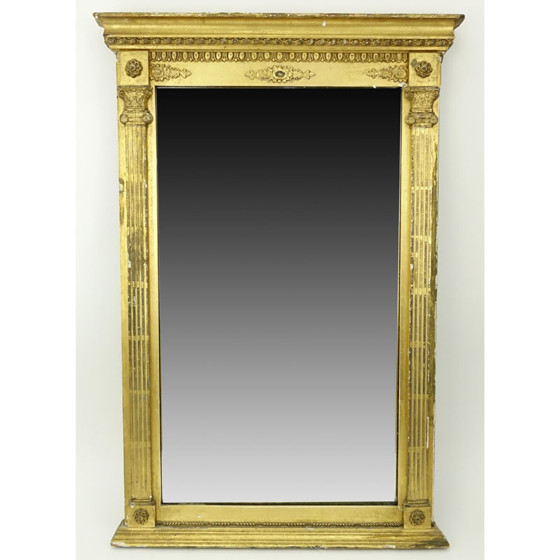 Early 20th Century Italian Louis XVI Style Giltwood Mirror. Carved scroll motif on apron with two columns on each side.
