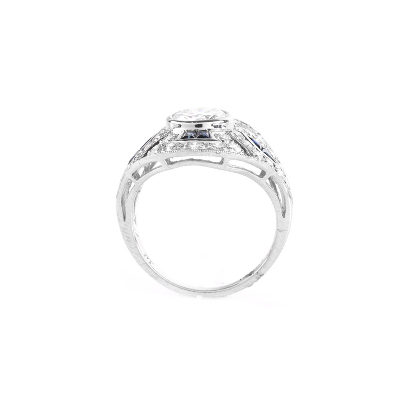 Art Deco style Diamond, Sapphire and Platinum Ring set in the Center with Round Brilliant Cut Diamond.