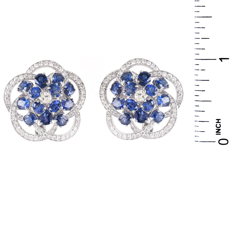 Approx. 8.50 Carat Oval Cut Sapphire, 2.85 Carat Round Brilliant Cut and Platinum earrings.