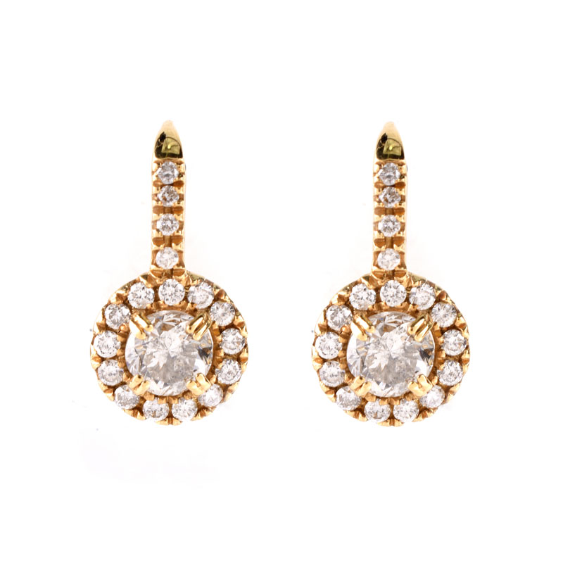 Round Brilliant Cut Diamond and 18 Karat Yellow Gold Pendant Earrings. Stamped 18K. Very good condition.