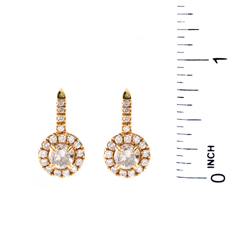 Round Brilliant Cut Diamond and 18 Karat Yellow Gold Pendant Earrings. Stamped 18K. Very good condition.