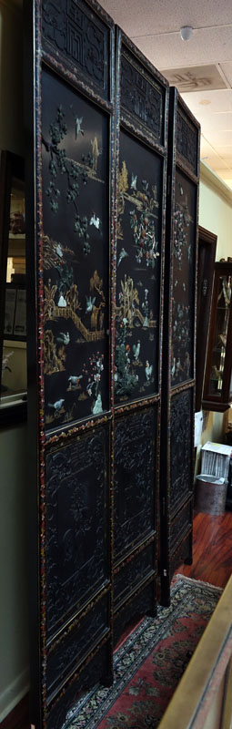 Important Palace-Size Late 19th or Early 20th Century Chinese Black Lacquer Wood, Deep Relief Carved Six Panel Screen Inlaid with Jade, Carnelian, and Rose Quartz. 