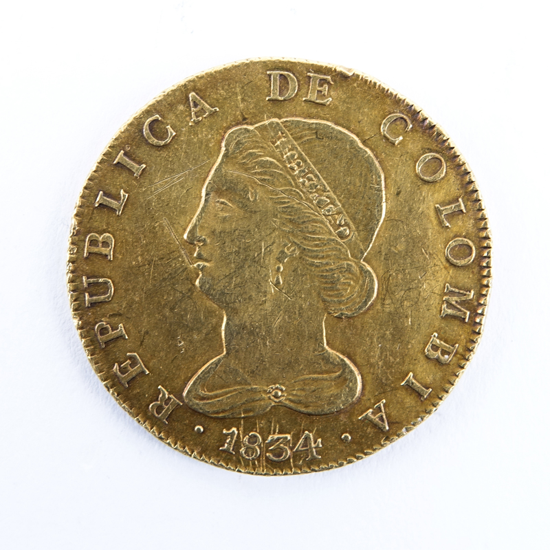 1834 Colombian Gold 8 Escudos. Bogota Mint. Bust facing left/Crossed bow & arrows on fasces. Some Wear. Weighs approx. 27 grams.
